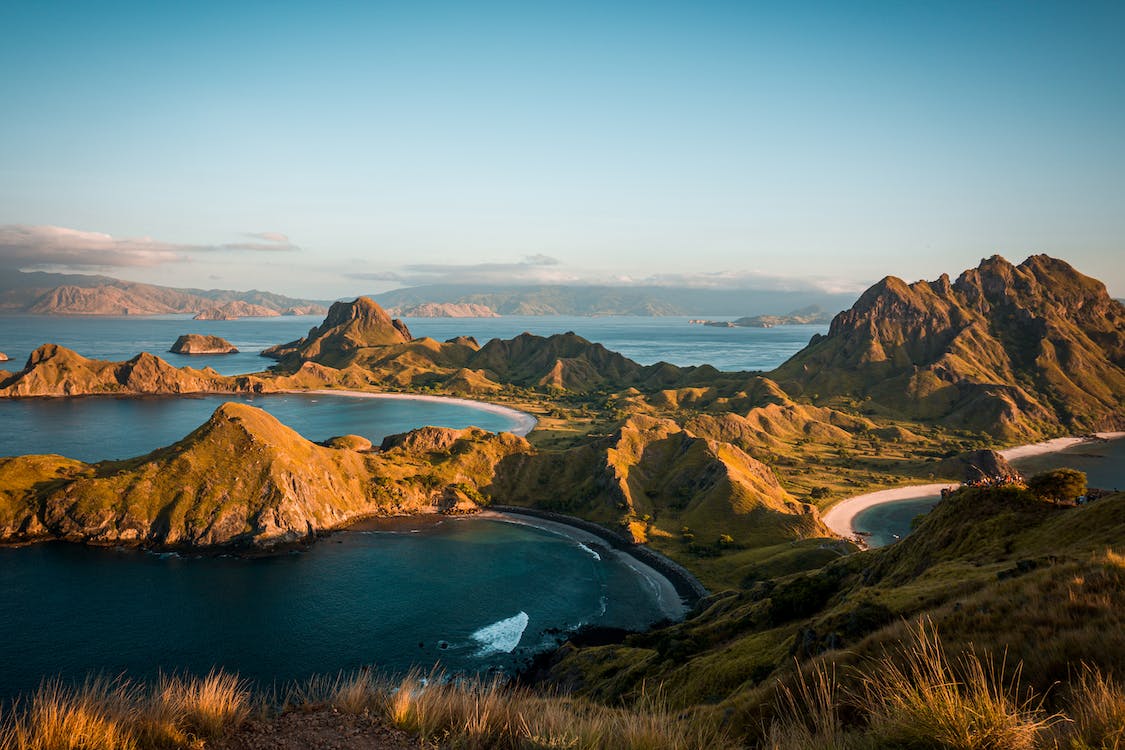 Free Green Mountains and Body of Water Stock Photo